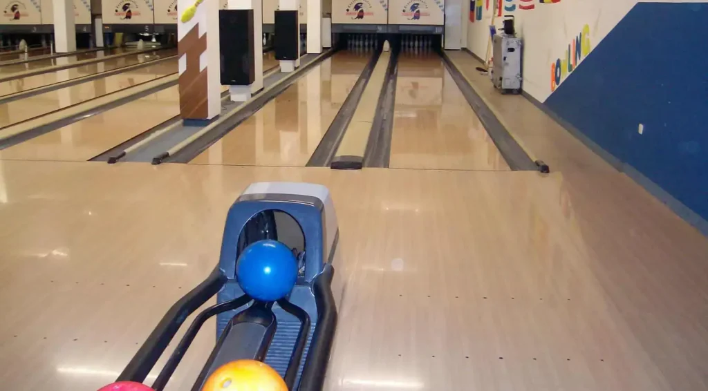 Bowling alley with lanes and pins.