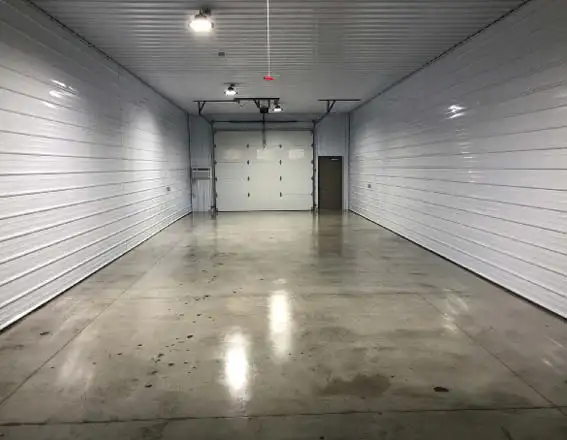 Polished concrete floor in a clean and sealed indoor garage.