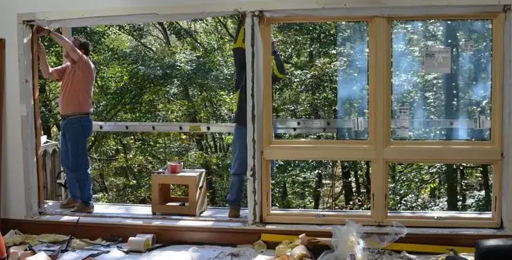 A man installs a window, showcasing the replacement process in Florida.