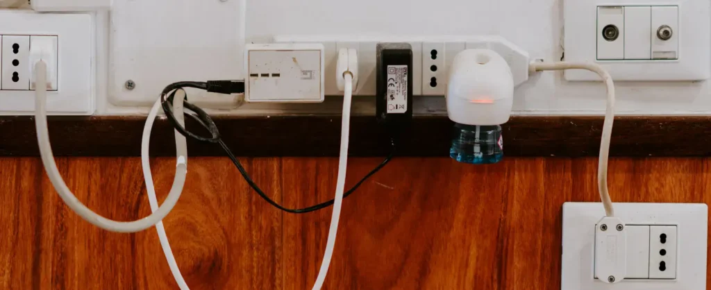 Multiple electrical outlets and switches on a wall.