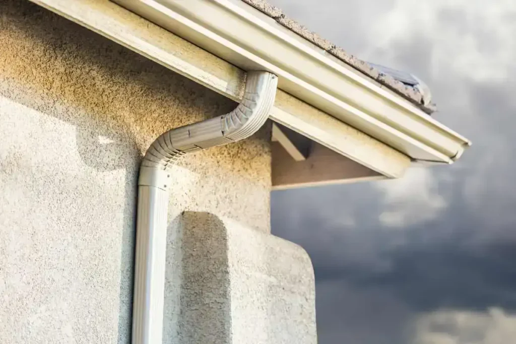 Close-up of a seamless gutter on a house, highlighting its smooth design.